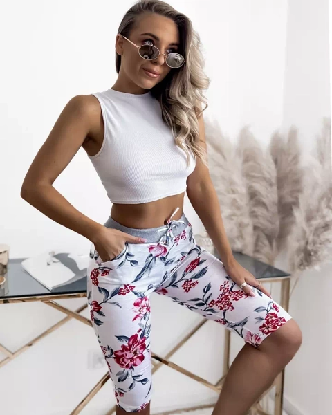 Біло-рожеві жіночі шорти 3/4 з принтом PLUS SIZE - Одяг