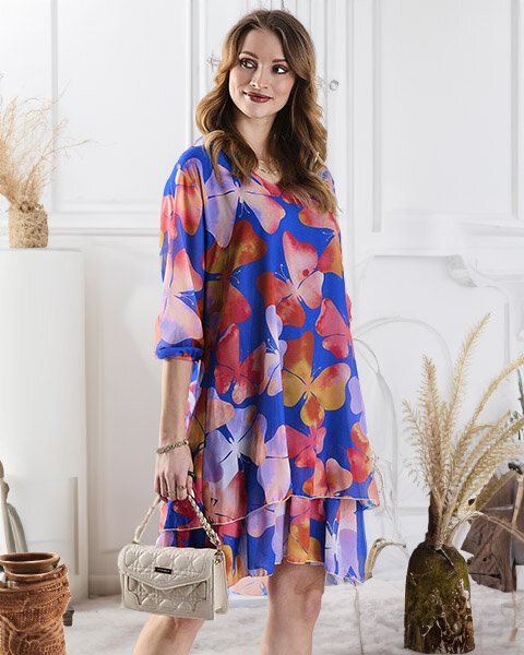 Темно-синя жіноча сукня до коліна з принтом і воланом - Одяг